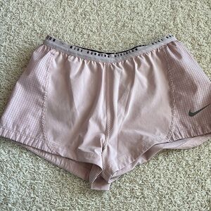 Mauve Nike running shorts